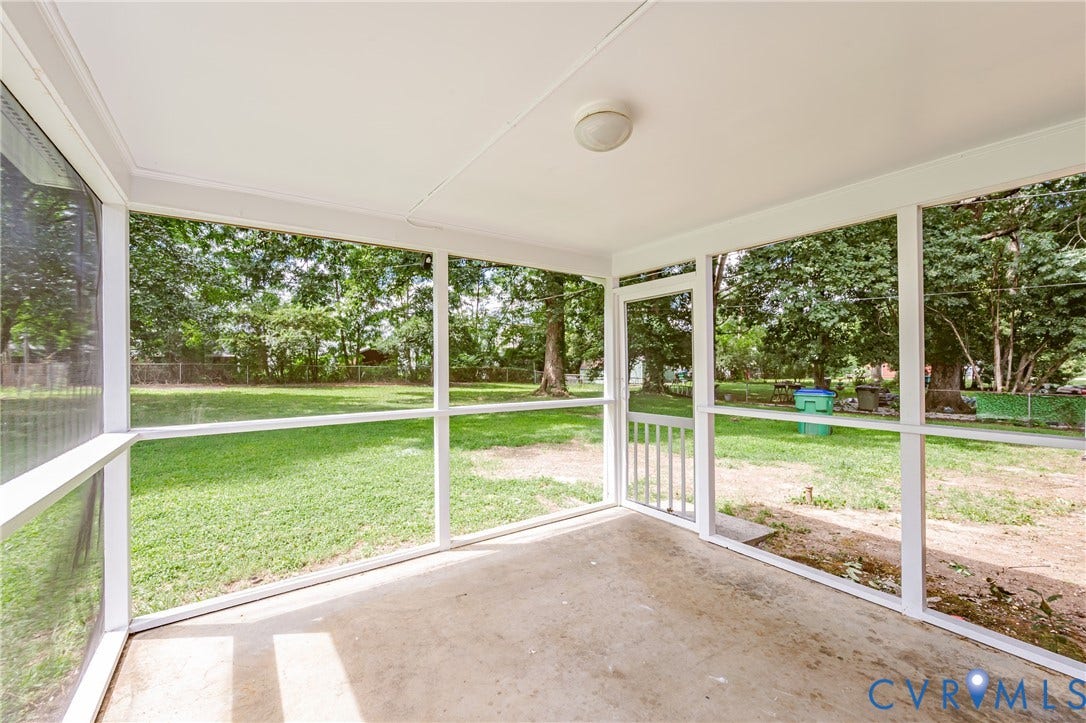 1724 Alaska Drive, Richmond, VA 23224 Screened-in porch featuring a concrete floor, white ceiling, and a built-in ceiling light