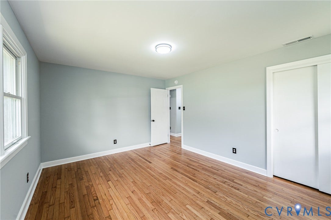 1724 Alaska Drive, Richmond, VA 23224 Hardwood flooring, painted walls, white trim, recessed lighting, and a window