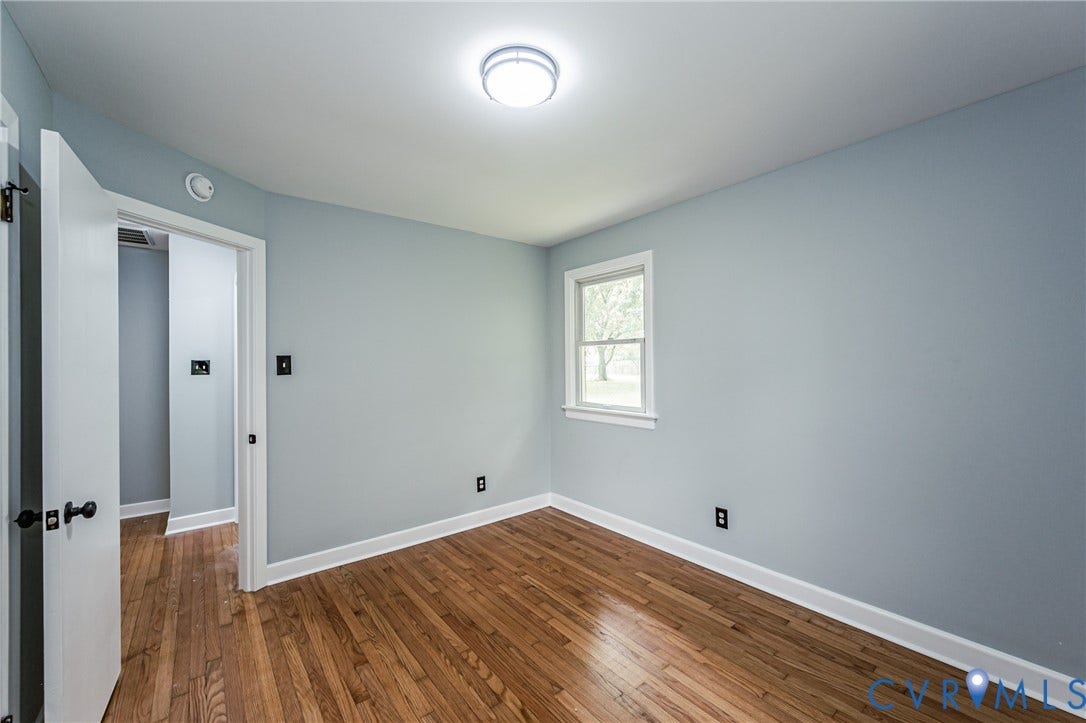 1724 Alaska Drive, Richmond, VA 23224 Hardwood flooring, painted walls, white trim, single window, and flush mount lighting