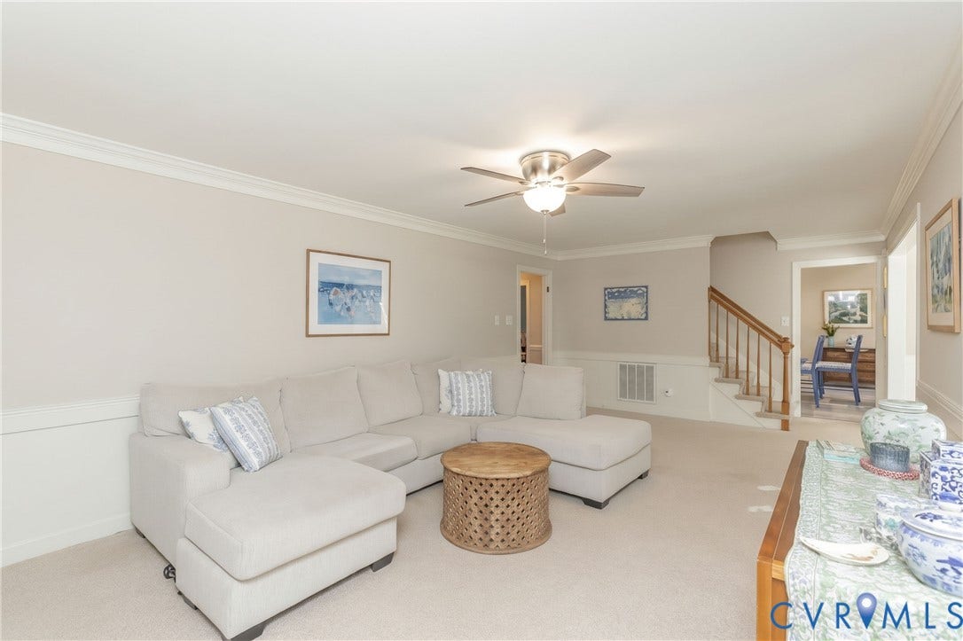 2120 Willowick Lane, Henrico, VA 23238 Carpeted flooring, crown molding, chair rail molding, ceiling fan with integrated lighting, and a staircase with wood handrails