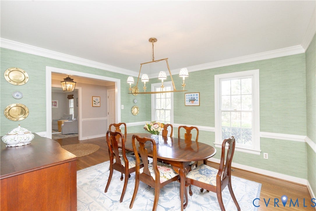 2120 Willowick Lane, Henrico, VA 23238 Hardwood flooring, decorative wall treatment, crown molding, double windows, and a brass-finish chandelier