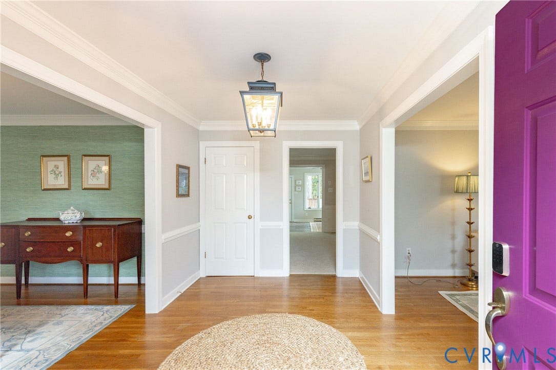 2120 Willowick Lane, Henrico, VA 23238 Hardwood-style flooring throughout, crown molding details, a paneled door, and a traditional lantern-style ceiling fixture