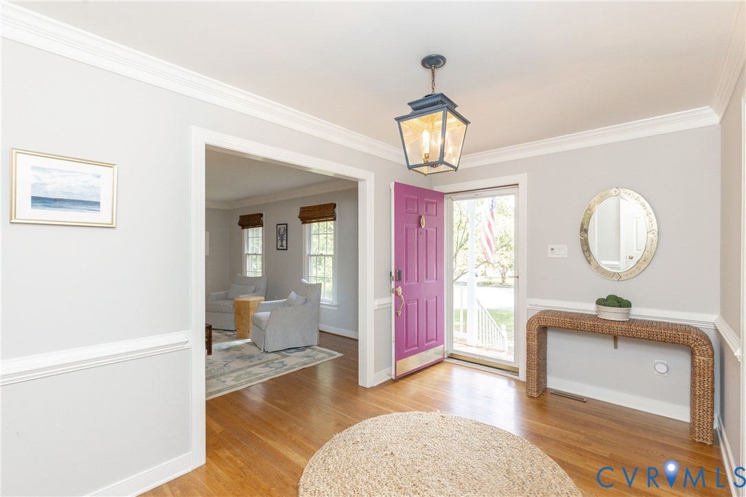 2120 Willowick Lane, Henrico, VA 23238 Hardwood flooring, crown molding, chair rail molding, and a decorative front door