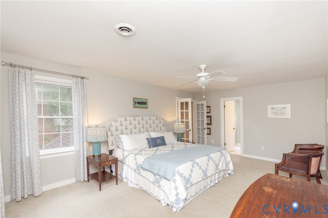 2120 Willowick Lane, Henrico, VA 23238 Neutral wall tones, overhead ceiling fan, white trim, and a double window