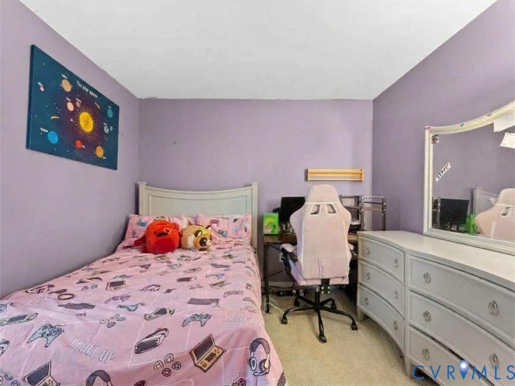 6507 Fairpines Road, North Chesterfield, VA 23234 Carpeted flooring, window with white trim, light purple wall paint, white door, and white ceiling