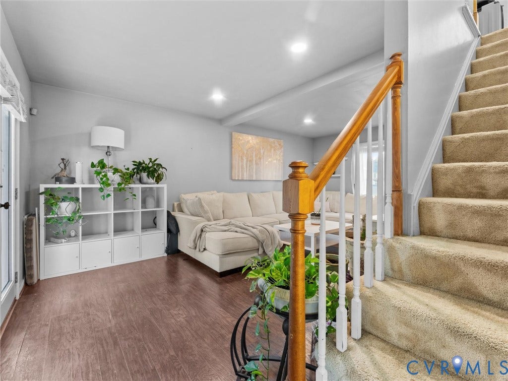 6507 Fairpines Road, North Chesterfield, VA 23234 Wood-finish flooring, recessed lighting, and a carpeted staircase with a wood handrail