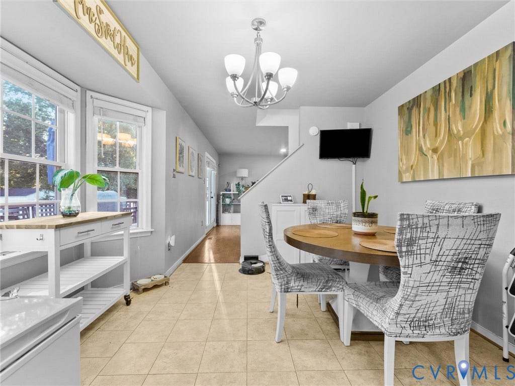 6507 Fairpines Road, North Chesterfield, VA 23234 Tile flooring, dual windows with white trim, recessed lighting, and a contemporary chandelier