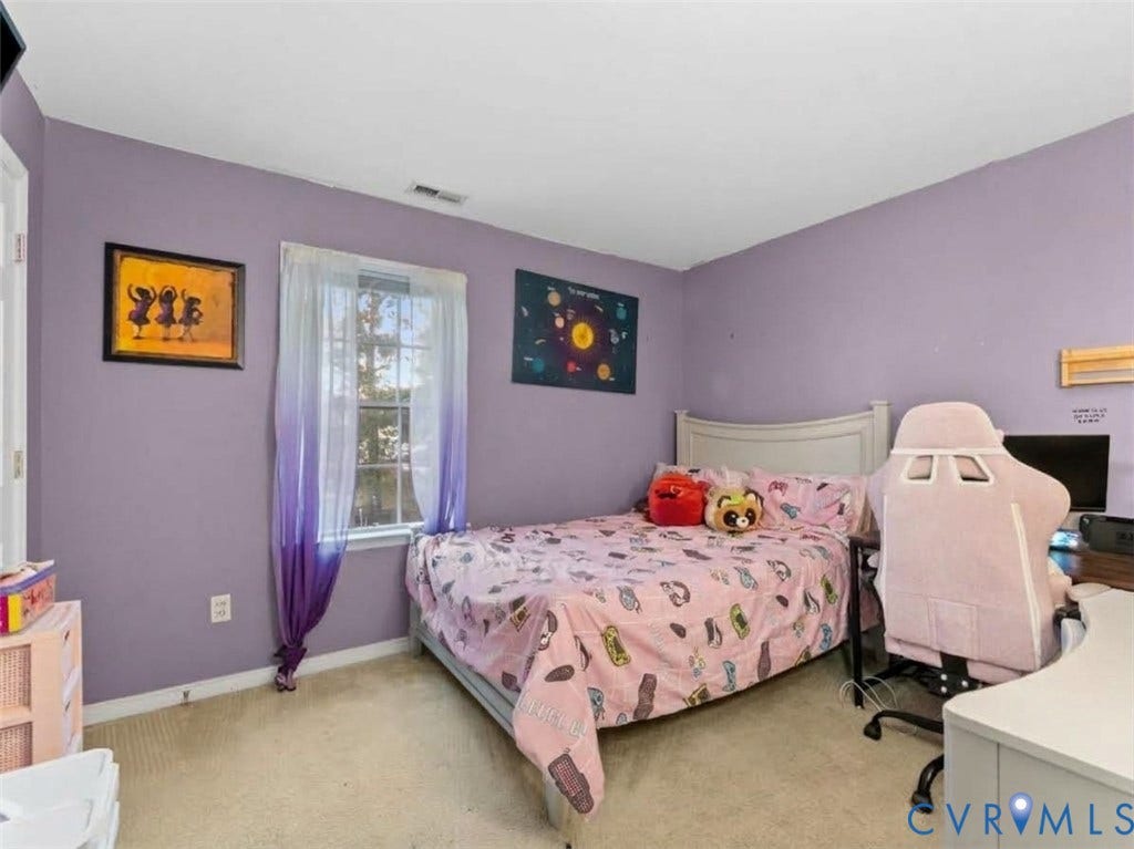 6507 Fairpines Road, North Chesterfield, VA 23234 Carpeted flooring, window with white trim, light purple wall paint, white door, and white ceiling