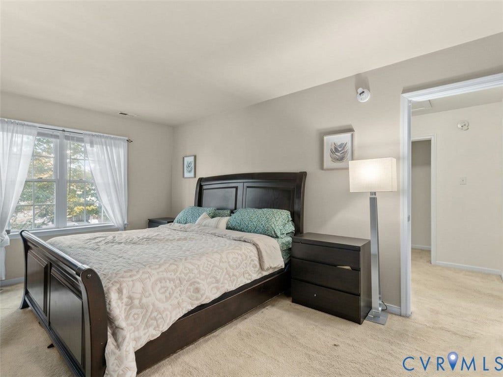 6507 Fairpines Road, North Chesterfield, VA 23234 Soft neutral wall color, window with natural light, and plush carpet flooring