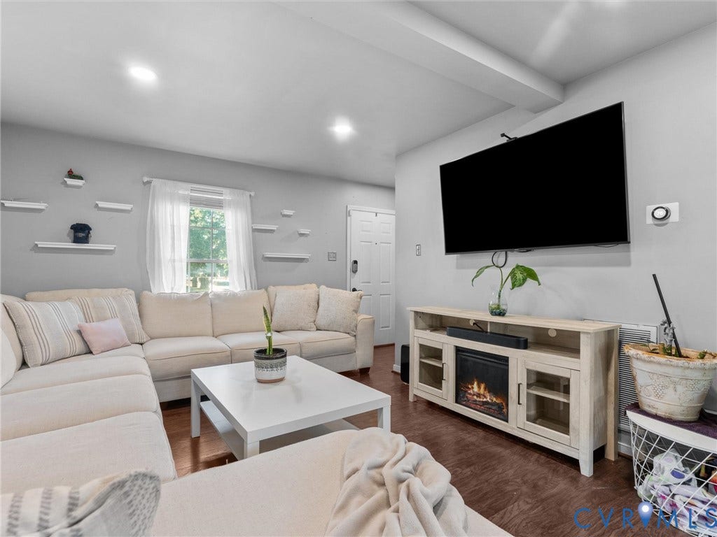 6507 Fairpines Road, North Chesterfield, VA 23234 Wood-finish flooring, recessed lighting, and white floating shelves