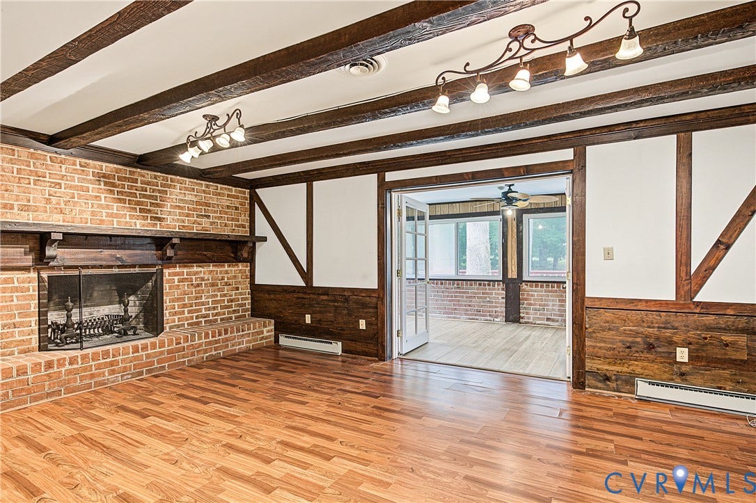 13310 Gladehill Road, Hidden Valley Estates, Chesterfield, VA 23831 Brick fireplace with a wooden mantel and hearth