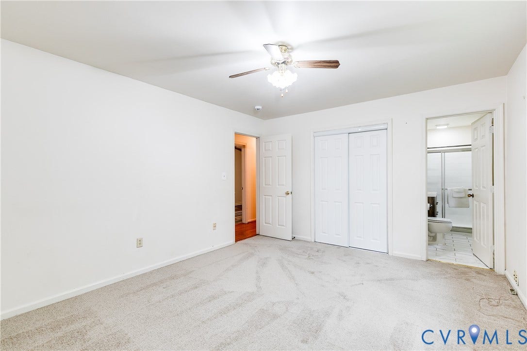 13310 Gladehill Road, Hidden Valley Estates, Chesterfield, VA 23831 Carpeted room with white walls, ceiling fan with light fixture, and two panel doors