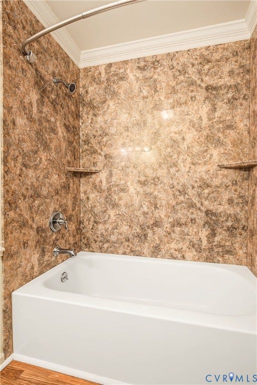 13310 Gladehill Road, Hidden Valley Estates, Chesterfield, VA 23831 White tub with chrome fixtures, integrated wall shelving, and a patterned shower surround