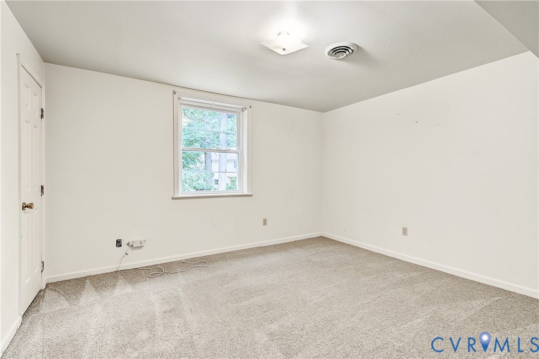 13310 Gladehill Road, Hidden Valley Estates, Chesterfield, VA 23831 Neutral wall colors, light-toned carpeting, and a double-hung window