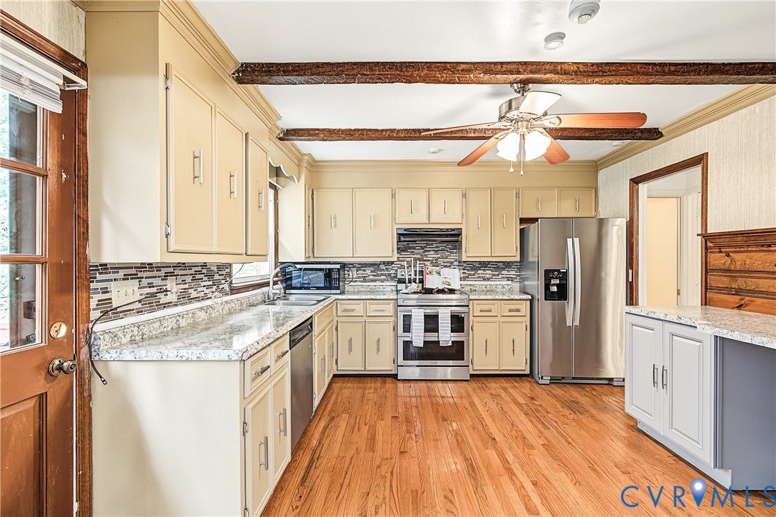 13310 Gladehill Road, Hidden Valley Estates, Chesterfield, VA 23831 Kitchen featuring wood-finish flooring, exposed ceiling beams, stainless steel appliances, light-toned cabinetry, and granite countertops