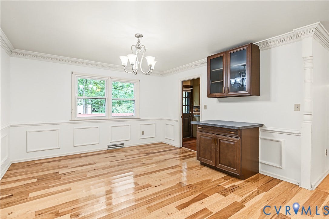 13310 Gladehill Road, Hidden Valley Estates, Chesterfield, VA 23831 Hardwood flooring, crown molding, chair rail molding, built-in cabinetry with glass-front uppers, and a chandelier