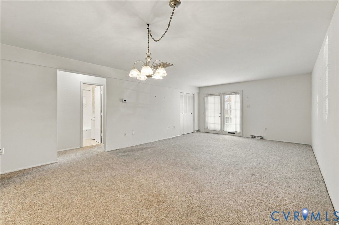 12 Snughaven Road, Hamlet, Henrico, VA 23228 Carpeted living space with a chandelier, white walls, and double glass doors