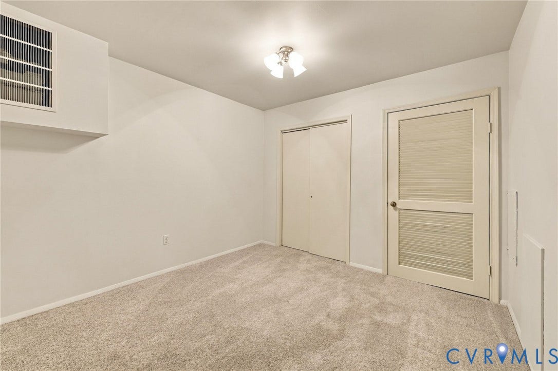 12 Snughaven Road, Hamlet, Henrico, VA 23228 Neutral-toned wall-to-wall carpeting, white painted walls, and a semi-flush mount ceiling light