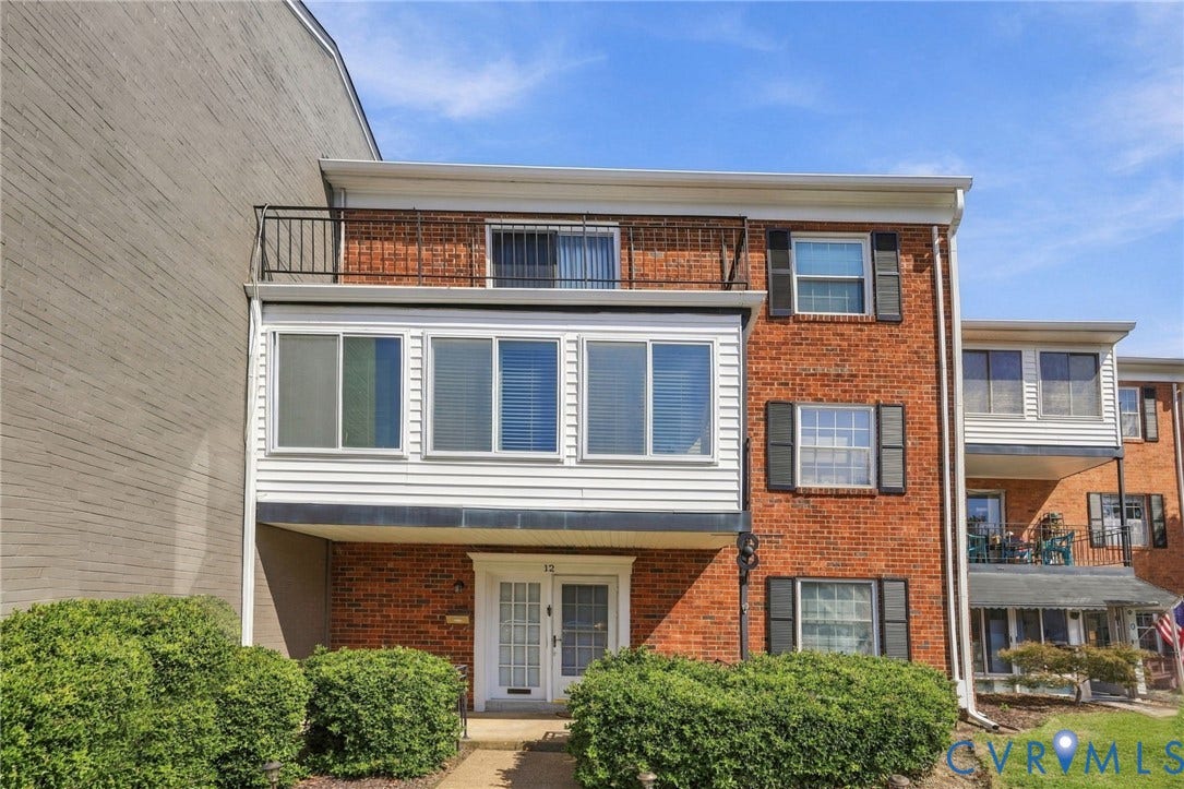 12 Snughaven Road, Hamlet, Henrico, VA 23228 Brick exterior with white siding accents and dark shutters