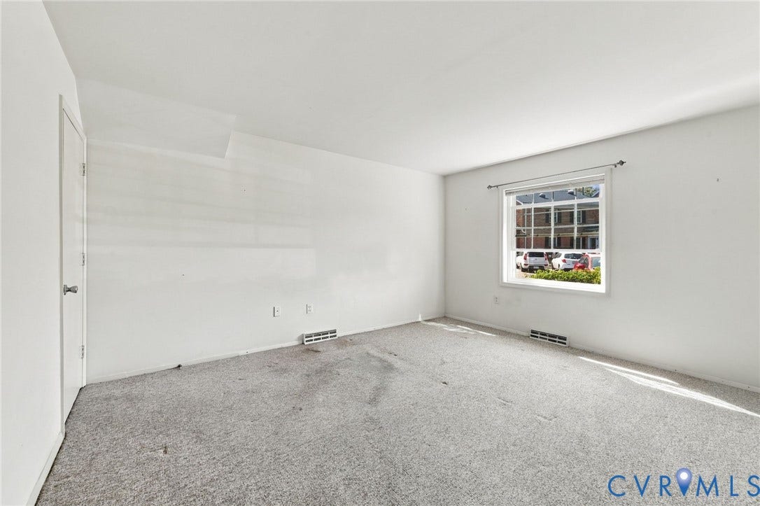 12 Snughaven Road, Hamlet, Henrico, VA 23228 Carpeted room featuring a single window and white walls