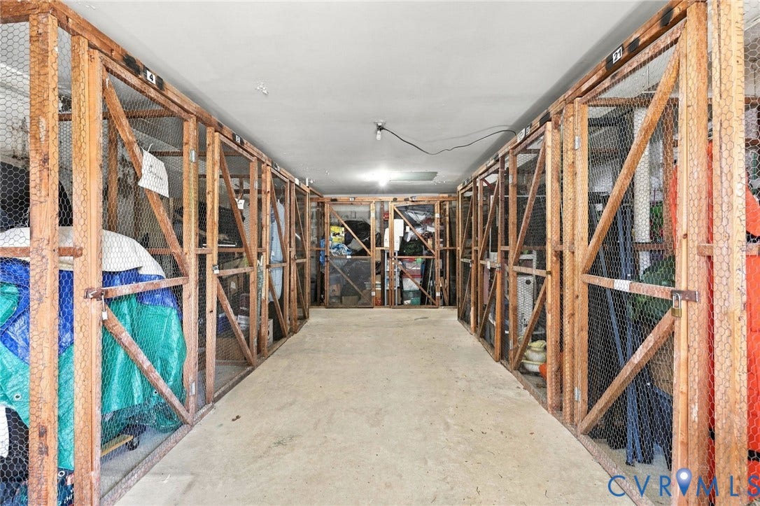 12 Snughaven Road, Hamlet, Henrico, VA 23228 Storage facility featuring concrete flooring and individual wood-framed wire mesh enclosures