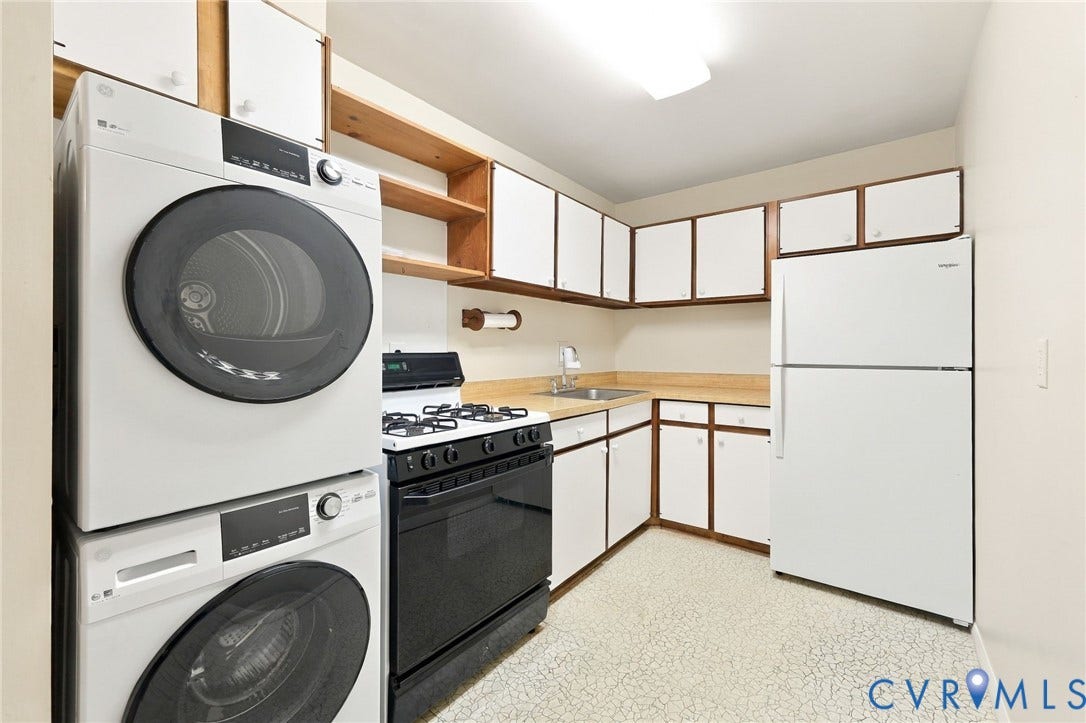 12 Snughaven Road, Hamlet, Henrico, VA 23228 White cabinetry with wood trim, light-toned countertops, and a white refrigerator