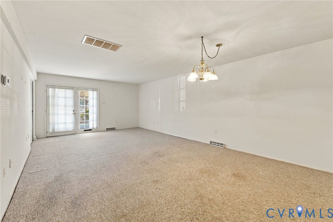 12 Snughaven Road, Hamlet, Henrico, VA 23228 Recessed lighting, double glass-paneled doors, and a decorative chandelier