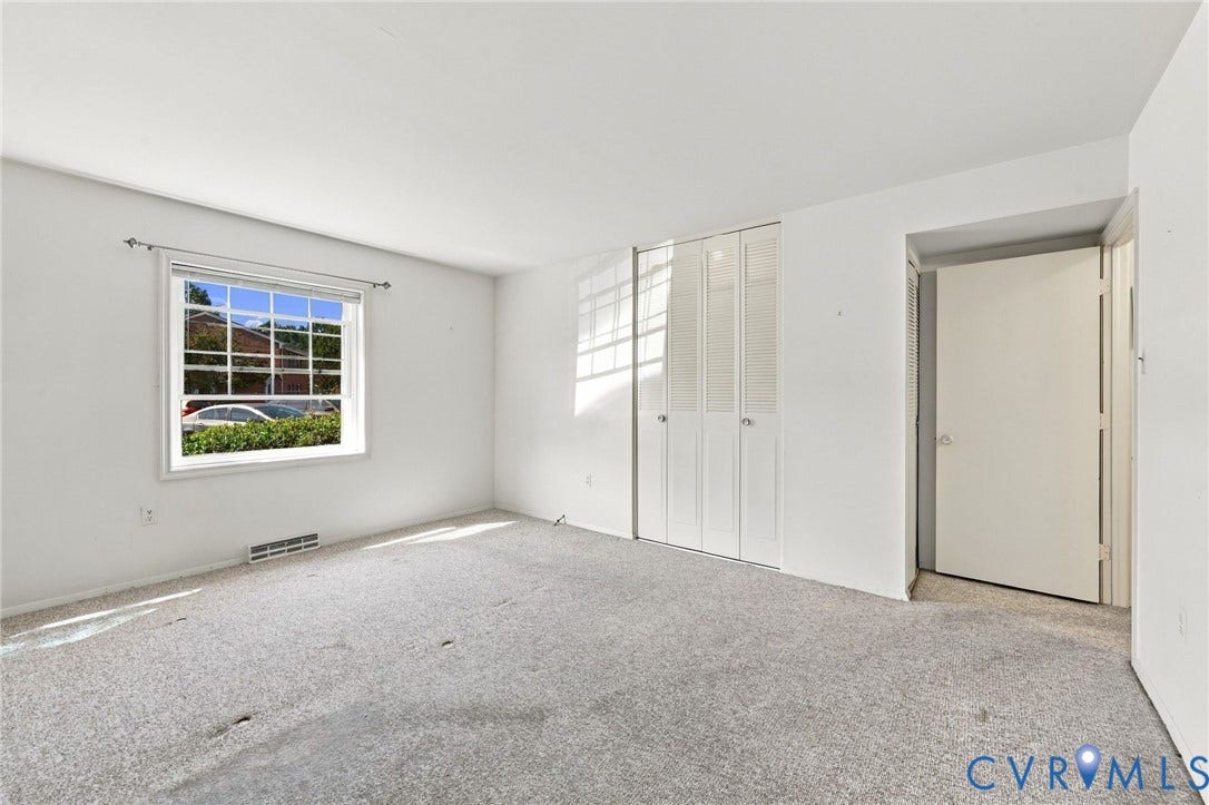 12 Snughaven Road, Hamlet, Henrico, VA 23228 White walls, window with grilles, bi-fold closet doors, wall-to-wall carpeting, and a standard interior door