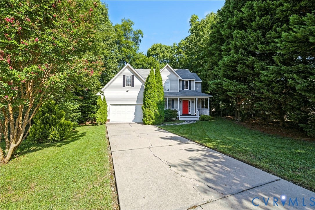 15724 Winding Ash Drive, Chesterfield, VA 23832 Two-story residence featuring light gray siding and a prominent red entry door