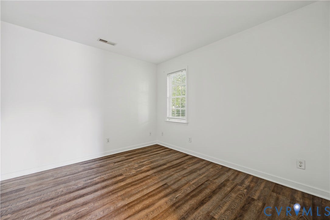 15724 Winding Ash Drive, Chesterfield, VA 23832 Recessed window with white blinds, wood-finish flooring, white walls, and white trim