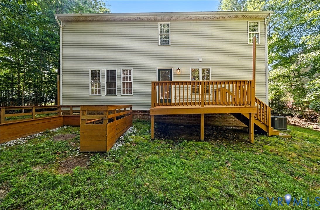 15724 Winding Ash Drive, Chesterfield, VA 23832 Rear exterior featuring horizontal siding, multiple windows, a wood deck with railings and stairs, and a built-in wood-finish planter box
