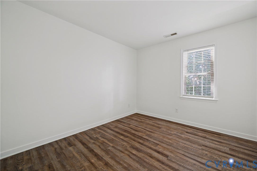 15724 Winding Ash Drive, Chesterfield, VA 23832 Wood-finish flooring, white walls, white trim, and a window with blinds