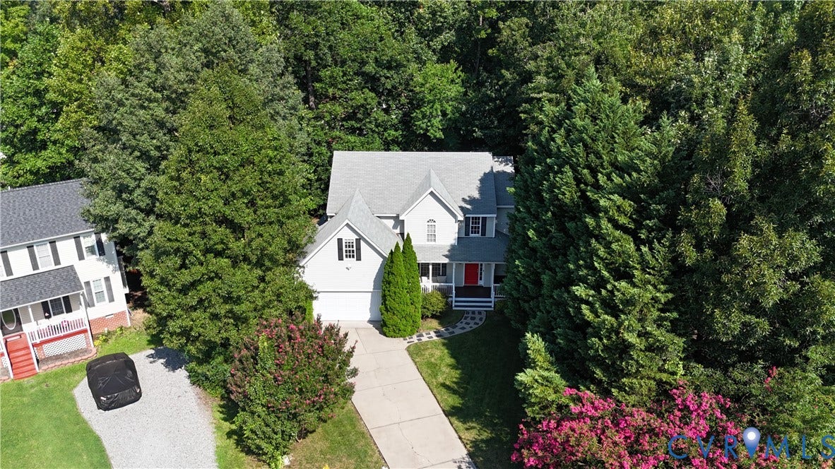 15724 Winding Ash Drive, Chesterfield, VA 23832 Two-story residence with a light gray facade, a prominent front gable, and a covered porch