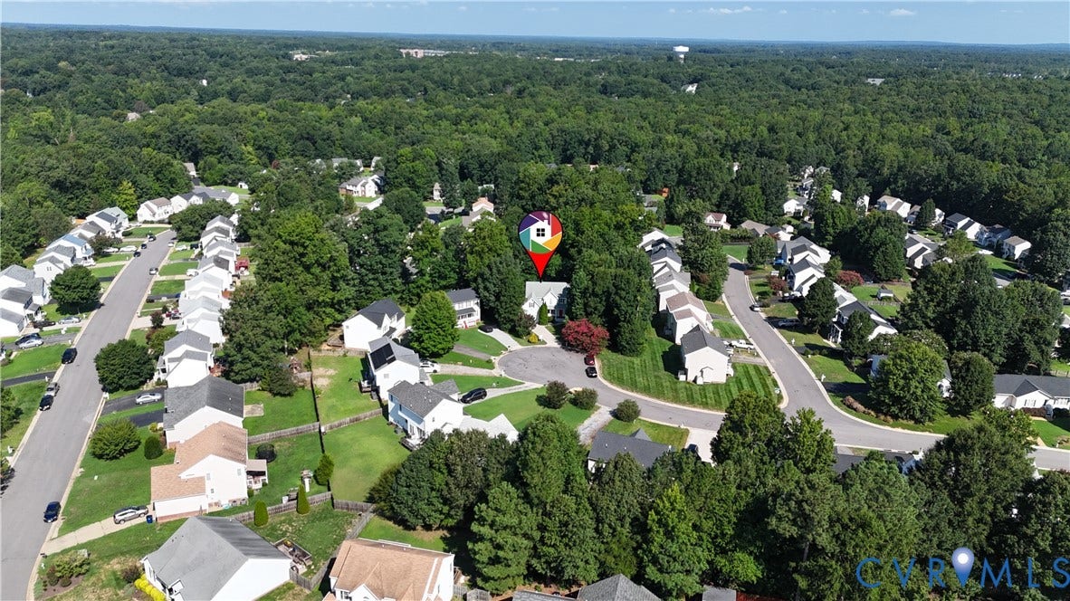 15724 Winding Ash Drive, Chesterfield, VA 23832 Aerial perspective showcasing a residential neighborhood with mature trees, established properties, and paved streets