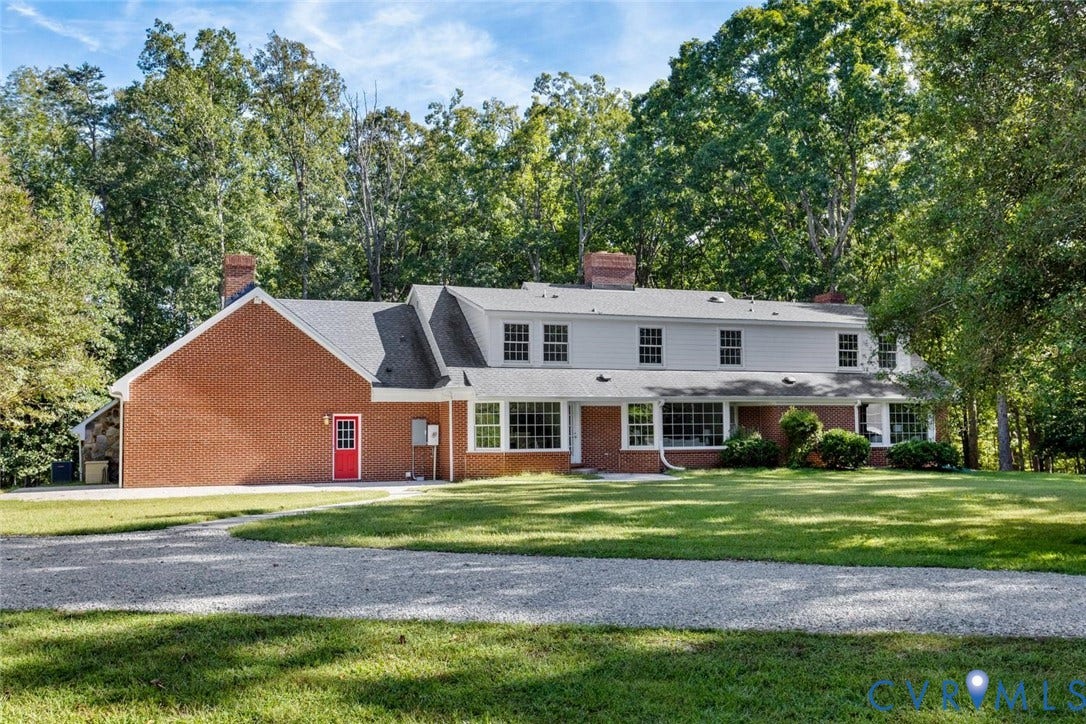 Brick and siding exterior with a gabled roofline