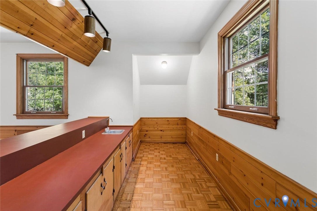 Wood-paneled walls and a parquet floor