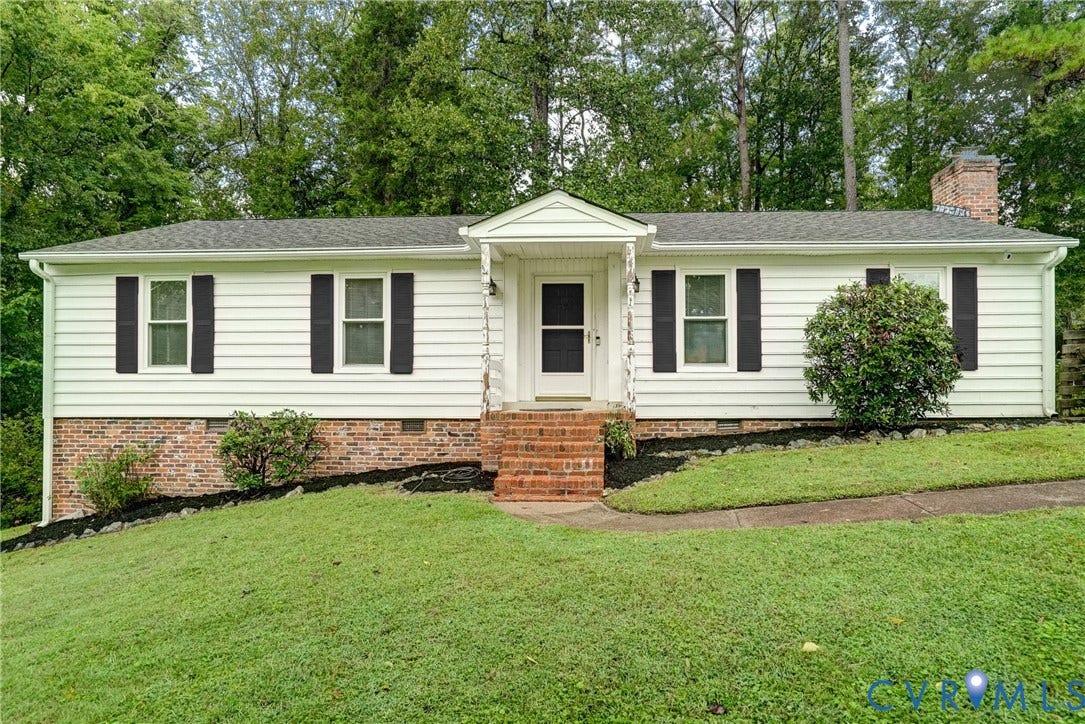 2602 Seacliff Court, Richmond, VA 23236 White siding exterior with brick foundation, covered entry, and dark shutters
