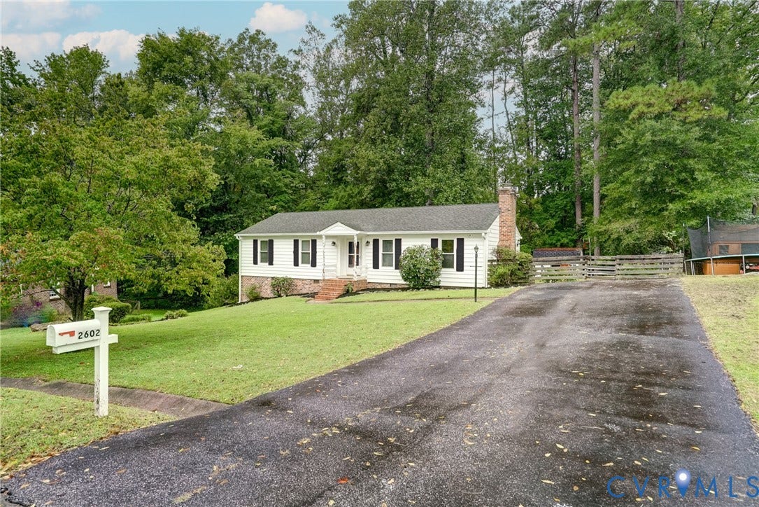 2602 Seacliff Court, Richmond, VA 23236 White siding residence with dark shutters and a gabled roof