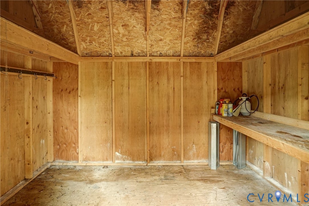 2602 Seacliff Court, Richmond, VA 23236 Interior wood-paneled structure featuring exposed ceiling joists and wood-finish flooring