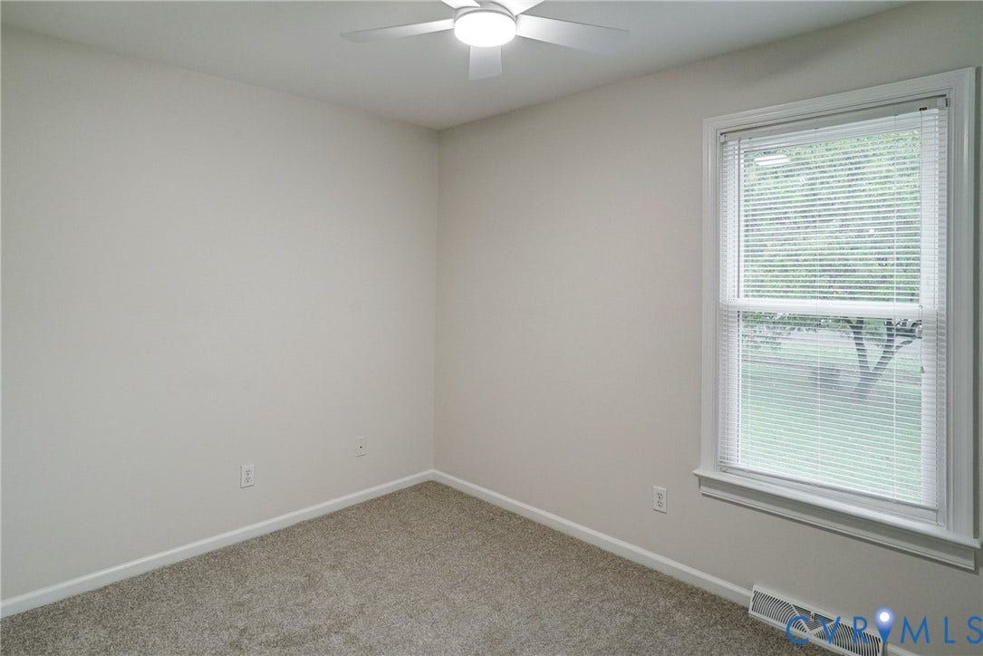 2602 Seacliff Court, Richmond, VA 23236 Bedroom 2, Neutral wall finishes, textured carpeting, double-pane window, and a ceiling fan with integrated lighting