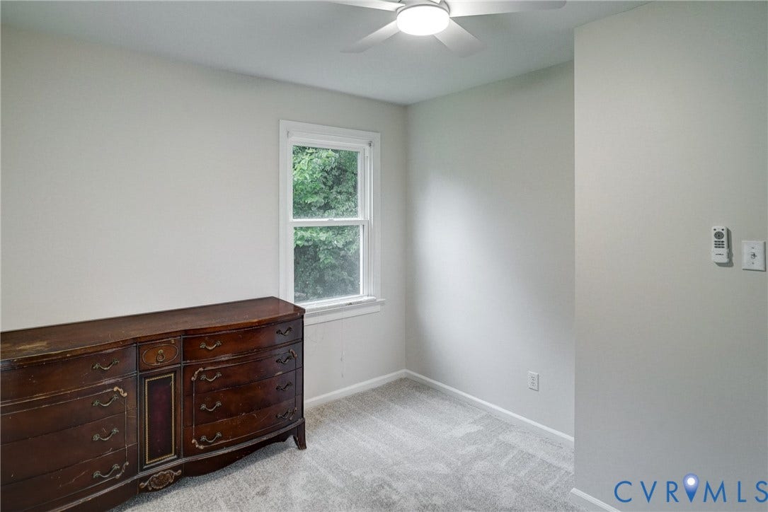 2602 Seacliff Court, Richmond, VA 23236 Bedroom 3, Neutral wall color, carpeted flooring, double-hung window, ceiling fan with integrated lighting, wall-mounted thermostat