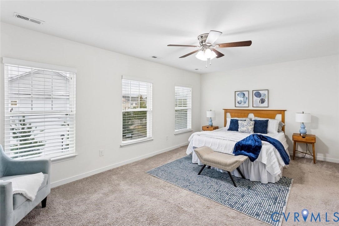 10420 Perennial Drive, Ridgefield Green Townhome, Henrico, VA 23233 Wall-to-wall carpeting, multiple windows with blinds, ceiling fan with integrated lighting, recessed lighting, and a wood-finish bed frame