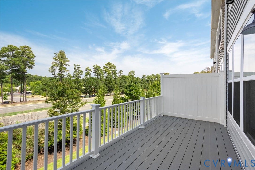 10420 Perennial Drive, Ridgefield Green Townhome, Henrico, VA 23233 Private balcony featuring composite decking, white railing, and an adjacent privacy wall