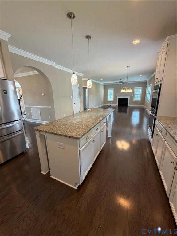 12146 Elnora Lane, Glen Allen, VA 23059 Kitchen island with granite countertop, integrated cabinetry, and pendant lighting