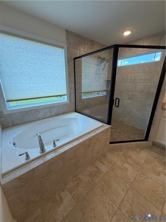 12146 Elnora Lane, Glen Allen, VA 23059 Built-in soaking tub with chrome fixtures, glass-enclosed shower with tile surround, and coordinating floor tiling