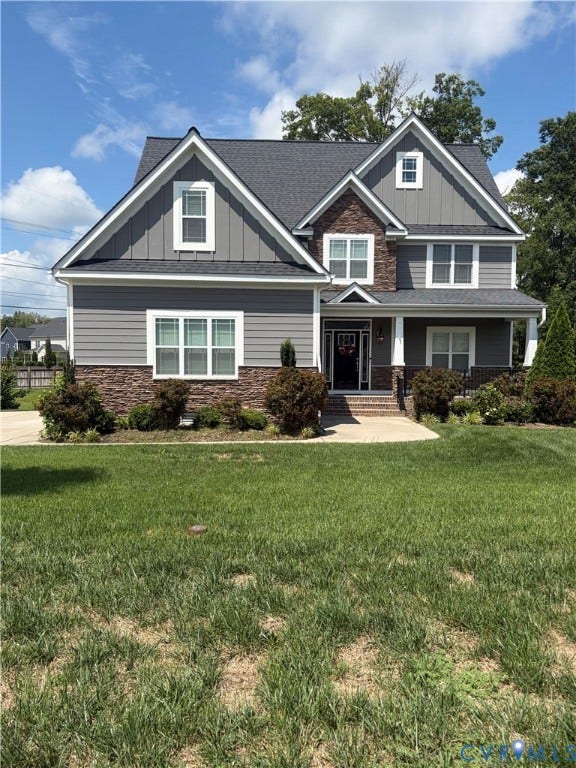 12146 Elnora Lane, Glen Allen, VA 23059 Two-story residence featuring a covered front porch, stone and siding exterior, and an asphalt shingle roof
