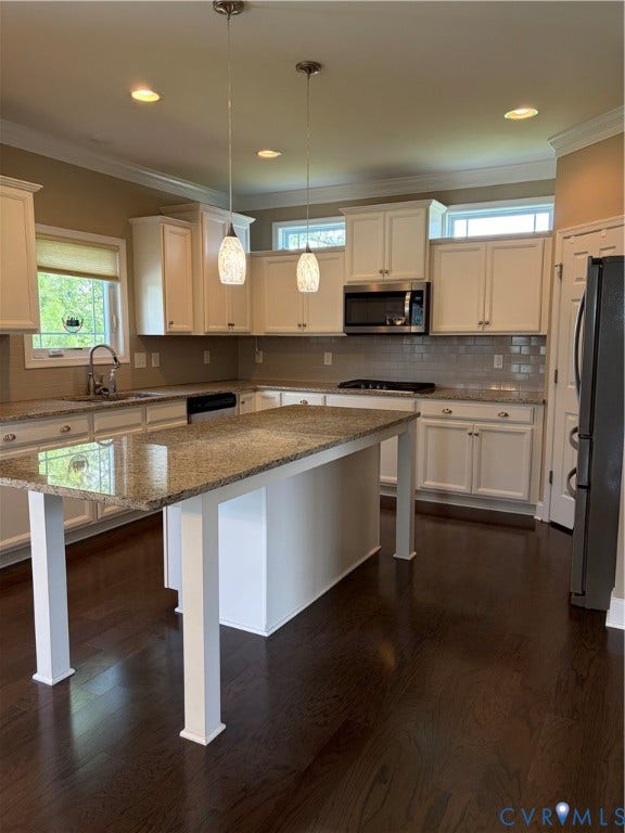 12146 Elnora Lane, Glen Allen, VA 23059 Gourmet kitchen featuring white cabinetry, granite countertops, stainless steel appliances, dark wood-finish flooring, and pendant lighting