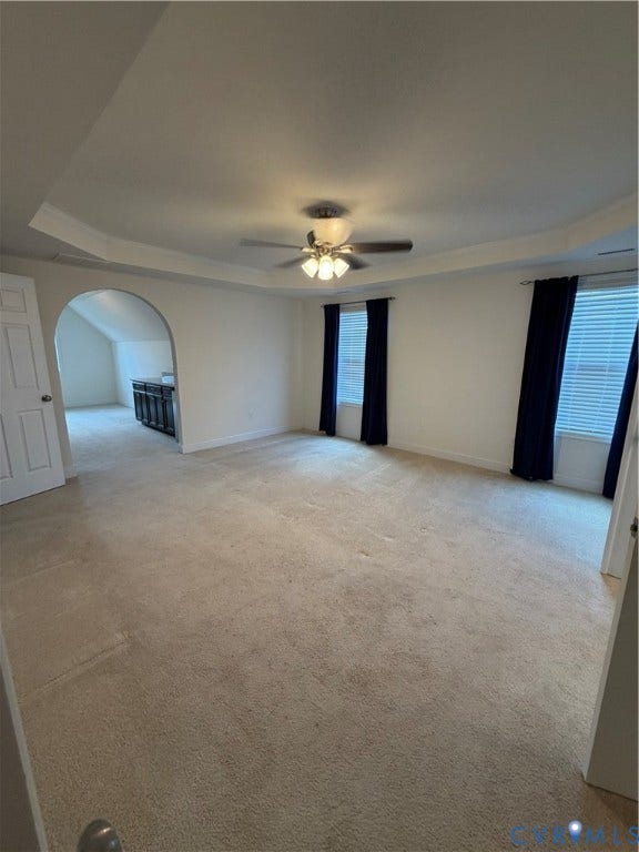 12146 Elnora Lane, Glen Allen, VA 23059 Tray ceiling with recessed lighting, ceiling fan, arched doorway, and carpet flooring