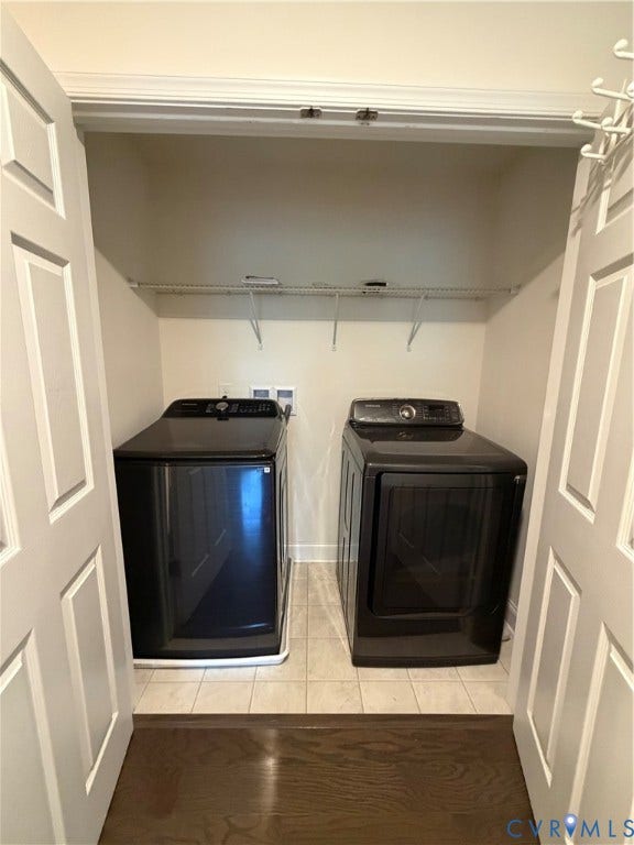 12146 Elnora Lane, Glen Allen, VA 23059 Laundry closet with tiled flooring, wire shelving, and bi-fold doors