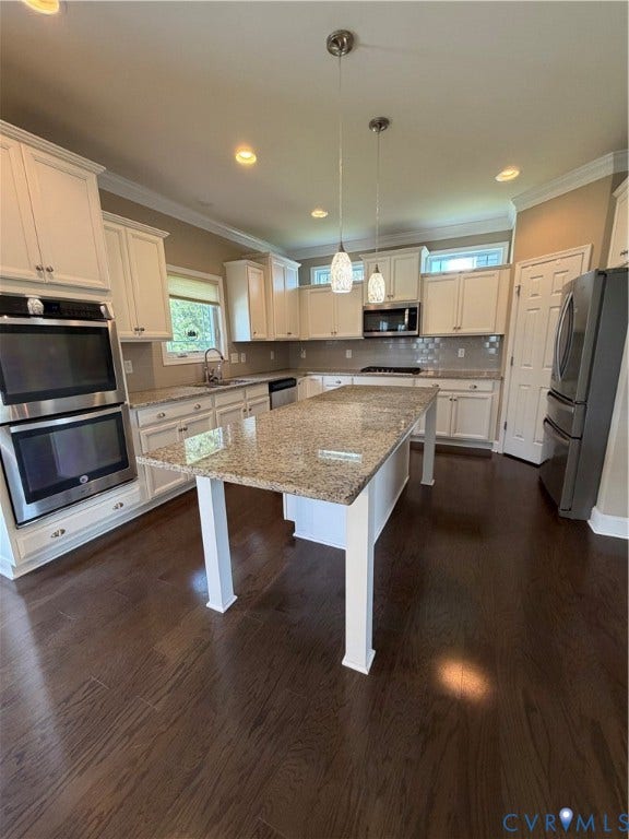 12146 Elnora Lane, Glen Allen, VA 23059 Kitchen featuring wood-finish flooring, white cabinetry, a large kitchen island with a stone countertop, stainless steel double ovens, and recessed lighting